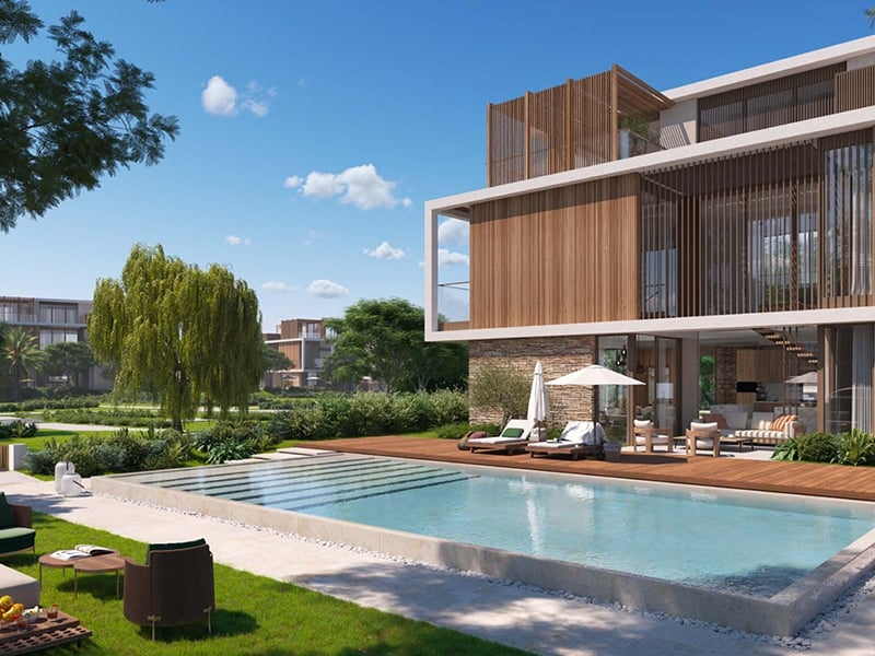 The Acres II by Meraas presents an exclusive collection of 5 to 7-bedroom villas, starting at AED 13.5M. A harmonious blend of elegance and sophistication, these homes offer expansive layouts designed for those who value both space and privacy. The villas are masterfully crafted, with large, open living areas that flow effortlessly into one another, creating a sense of freedom and fluidity. The gourmet kitchens, equipped with the finest finishes, offer a seamless transition into living and dining spaces, making them perfect for both intimate gatherings and larger social occasions. Luxurious bedrooms are generously proportioned, each featuring bespoke wardrobes, while the bathrooms are elegantly designed with top-tier fixtures and finishes. Surrounded by pristine landscaping, the community offers a range of exceptional amenities, including a lagoon clubhouse, a tranquil community park and a wellness-focused juice bar. A primary school adds convenience, ensuring that families can live in a setting that offers both peace and accessibility. Starting at AED 13.5M, The Acres II by Meraas offers 5 to 7-bedroom standalone villas. The handover is expected in Q4 2027 with a 65/35 payment plan.