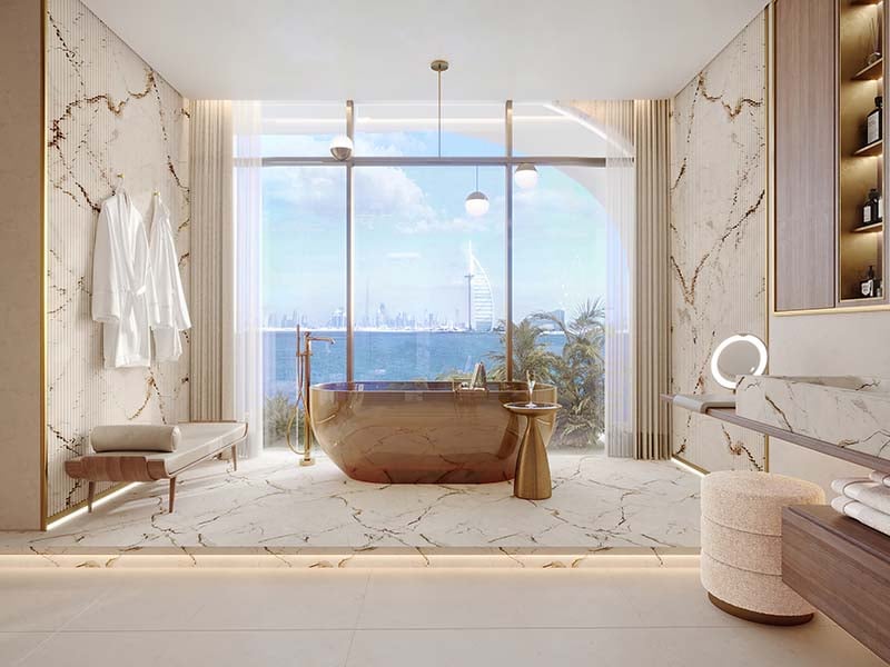 At the heart of Ocean House by Ellington Properties lies a commitment to exquisite oceanside living. Within this haven, a diverse range of 2 to 6-bedroom apartments, duplexes and penthouses awaits. As you step into the lobby, you'll be greeted by a minimalist hotel-like ambiance, defined by a double-height ceiling and elegant neutral decor. Lush greenery enhances the welcoming atmosphere, creating a serene sanctuary for residents and guests alike. Inside, these thoughtfully crafted abodes open to a world of contemporary elegance. With spacious designs and sophisticated neutral palettes, the interiors of Ocean House exude tranquility and sophistication. Floor-to-ceiling windows flood the space with natural light, offering residents breathtaking views of the surroundings. As you explore further, you'll find yourself drawn to the lush private pools and gardens, offering a tranquil retreat amidst the bustling city. Designed with utmost privacy and serenity in mind, these outdoor spaces provide residents with a sanctuary to relax and unwind. Venturing beyond the confines of your home, you'll encounter a wealth of private club-inspired amenities, including a 50-meter Olympic swimming pool, a wellness studio, clubhouse and cinema room.  Starting at AED 9.5M, Ocean House by Ellington Properties offers 2 to 6-bedroom apartments, duplexes and penthouses. The handover is expected in Q2 2026 with a 70/30 payment plan.