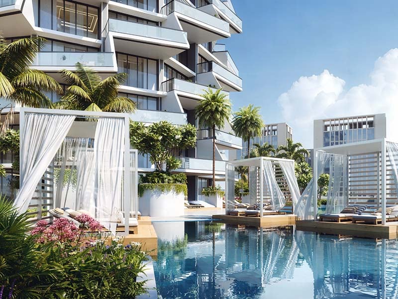 Binghatti Grove by Binghatti Developers offers a luxurious selection of 1 to 3-bedroom apartments in the family-friendly community of Jumeirah Village Circle (JVC). These off-plan apartments combine biophilic design with contemporary elegance, creating a unique blend of comfort and sustainability. Each residence features eco-friendly materials and sustainable facades, offering a mindful living environment for modern Dubai. The project provides an array of exceptional amenities, including a serene pool deck, outdoor yoga area, sports courts, and dedicated kids’ play areas. Residents can also enjoy an outdoor fitness zone and paddle courts, making it perfect for those looking to lead an active lifestyle. Additionally, the development offers stunning views of the surrounding green spaces, enhancing the overall living experience. Binghatti Grove’s prime location in JVC ensures easy access to Al Khail Road and Sheikh Mohammed Bin Zayed Road, allowing residents to reach key destinations like Downtown Dubai, Dubai Marina, and Dubai International Airport in under 25 minutes. The proximity to Circle Mall, parks, schools, and healthcare facilities adds further convenience for families and professionals. Starting at AED 1.2M, Binghatti Grove at JVC offers 1 to 3-bedroom apartments. The handover is expected in Q4 2026 with a 70/30 payment plan.