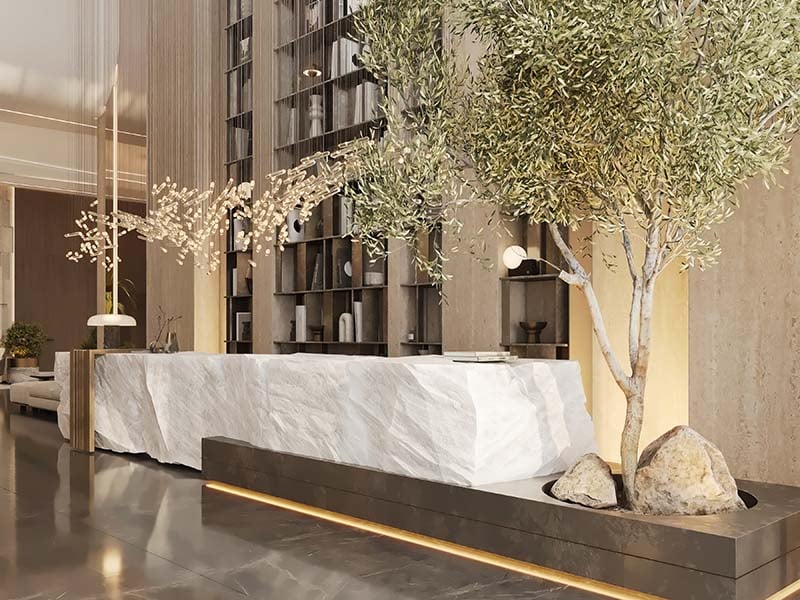 Cove by Imtiaz emerges in Dubailand as a vertical sanctuary. Its pearl white façade echoes the desert's timeless palette while its interiors redefine urban living. Within this tower, homes range from studios to two-bedroom retreats. Each space tells a story of thoughtful design. Kitchens become culinary stages with clean lines and intuitive layouts. Bathrooms transform into personal spas, marrying form and function. Bedrooms offer respite with views that frame Dubai's evolving skyline. Cove's true character unfolds in its shared spaces. An infinity pool seemingly merges with the horizon. For the active, a padel court awaits. A running track winds through the property, offering a path for morning jogs or evening strolls. Quieter moments find their place too. Serene cabanas offer pockets of tranquility. A yoga deck and a fully equipped gym, with its array of equipment, stand ready for those seeking a moment of calm or physical challenge. As day turns to evening, the open-air cinema flickers to life. Nearby, BBQ areas invite culinary experiments and social gatherings. Throughout Cove, green spaces create breathing room. These pockets of nature soften the urban edge, providing impromptu meeting spots or solitary retreats.