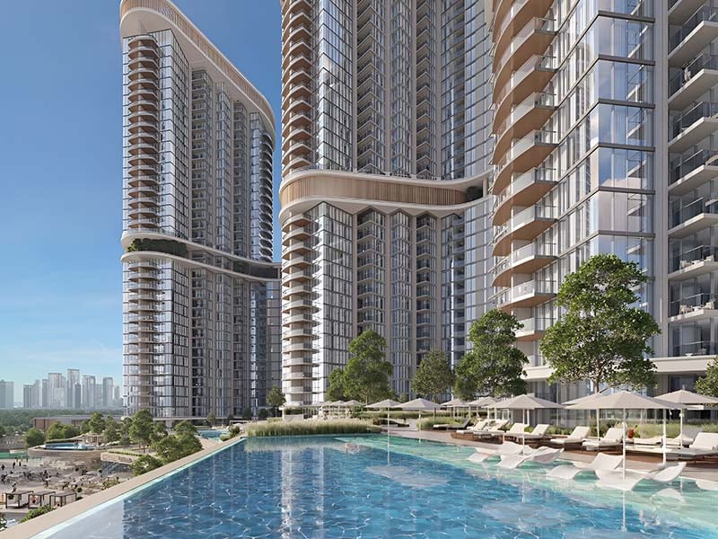 Skyscape Altius by Sobha Realty rises in Sobha Hartland II. It offers a blend of modern design and urban charm. The tower stands tall with 85 stories, each crafted to provide a sense of space and light. Here, every home opens to views of clear waters and the vibrant cityscape. The balance between natural beauty and urban life is seamless. Inside, you will find spaces designed for comfort and elegance. The layout of each apartment reflects a thoughtful approach to living. From one-bedroom to three-bedroom options, each home caters to different needs and preferences. The interiors showcase a blend of form and function, creating spaces that are both stylish and practical. Skyscape Altius at Sobha Hartland II offers more than just a place to live. It provides a lifestyle where the details matter. The open spaces and high ceilings add to the feeling of freedom and light. The views from the windows are more than just a sight; they are part of the living experience. This project is designed for those who seek both tranquility and connection to the city's pulse.