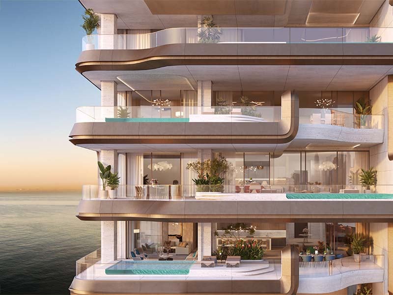 Ela Residences by Omniyat redefines ultra-luxury living on Palm Jumeirah. This exclusive collection of 3- and 4-bedroom apartments is crafted to embody the zenith of sophistication and privacy. Situated on one of the island’s most coveted plots, these residences offer sweeping views of the Arabian Gulf and the glittering Dubai skyline. Zaha Hadid's innovative architecture shapes Ela Residences with her signature style evident in the sweeping, fluid forms and cutting-edge aesthetics. Each residence features expansive terraces that seamlessly connect indoor living spaces with the serene outdoors. Floor-to-ceiling windows flood the interiors with natural light, enhancing the sense of openness and framing breathtaking vistas. The interiors, curated by the Dorchester Collection, reflect a commitment to luxury and refinement. Premium materials and bespoke finishes are meticulously chosen, creating spaces that are both elegant and functional. Each apartment is designed to offer a refined living experience where every detail contributes to an atmosphere of exclusivity and comfort. Located on the Eastern Crescent, Ela Residences offers direct beachfront access and panoramic views, providing a rare combination of privacy and prestige and setting a new standard for luxury living on Palm Jumeirah. Starting at AED 43M, Ela Residences by Omniyat offers 3- and 4-bedroom apartments. The handover is expected in Q1 2028 with a 60/40 payment plan.
