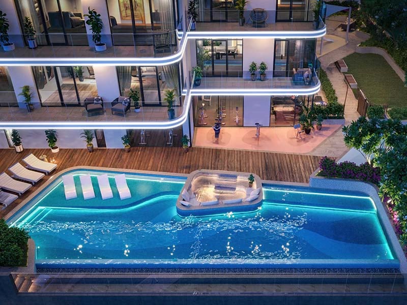 Avant Garde Residences, nestled in the heart of Jumeirah Village Circle, stands as a testament to thoughtful contemporary architecture. Its façade, adorned with subtle staggered curves, pays homage to the undulating dunes of the Arabian desert and the rhythmic tides of the nearby gulf. Striking a delicate balance between technical functionality and elegant aesthetics, the building's orientation was carefully orchestrated to optimize views from every apartment. This strategic positioning ensures practical living spaces and breathtaking perspectives throughout. Each detail of Avant Garde Residences speaks to a commitment to craftsmanship of the highest caliber. From the spacious interiors to the meticulously chosen materials, residents are assured of uncompromising quality and enduring value. Soft, soothing pastels coupled with a natural material palette create an atmosphere of timeless elegance and warmth. World-class fixtures and fittings further enhance this environment, promising durability and longevity. Floor-to-ceiling windows flood the interiors with natural light, seamlessly merging indoor and outdoor spaces. Thoughtfully designed balcony areas offer residents a retreat to enjoy fresh air and open skies. Starting at an accessible AED 650K, Avant Garde Residences by Skyline Builders presents a range of studio and one to two-bedroom apartments. The handover is slated for Q4 2026 with a convenient 50/50 payment plan.