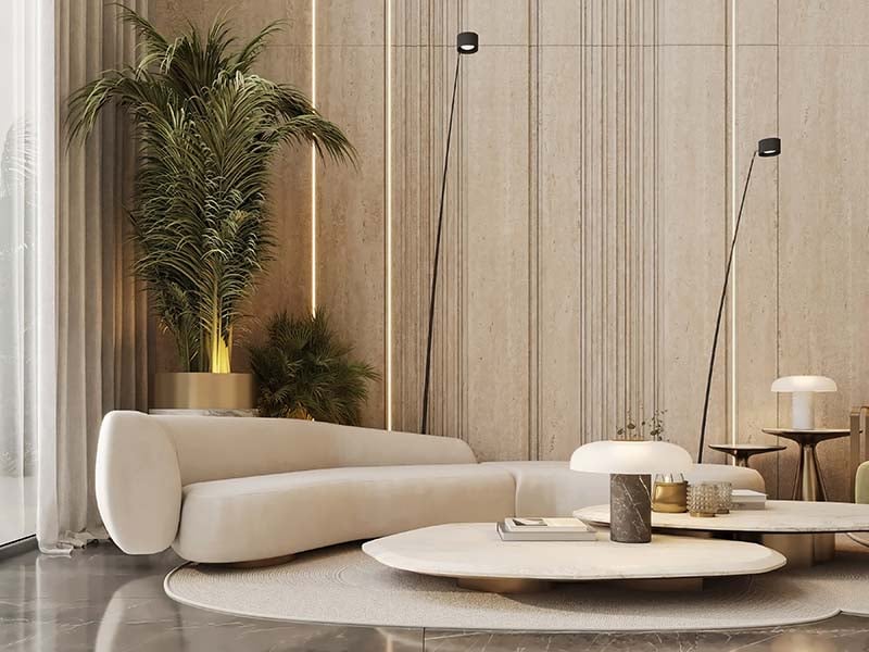 Cove by Imtiaz emerges in Dubailand as a vertical sanctuary. Its pearl white façade echoes the desert's timeless palette while its interiors redefine urban living. Within this tower, homes range from studios to two-bedroom retreats. Each space tells a story of thoughtful design. Kitchens become culinary stages with clean lines and intuitive layouts. Bathrooms transform into personal spas, marrying form and function. Bedrooms offer respite with views that frame Dubai's evolving skyline. Cove's true character unfolds in its shared spaces. An infinity pool seemingly merges with the horizon. For the active, a padel court awaits. A running track winds through the property, offering a path for morning jogs or evening strolls. Quieter moments find their place too. Serene cabanas offer pockets of tranquility. A yoga deck and a fully equipped gym, with its array of equipment, stand ready for those seeking a moment of calm or physical challenge. As day turns to evening, the open-air cinema flickers to life. Nearby, BBQ areas invite culinary experiments and social gatherings. Throughout Cove, green spaces create breathing room. These pockets of nature soften the urban edge, providing impromptu meeting spots or solitary retreats.