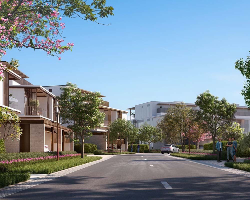 Nad Al Sheba Gardens 5 & 6 follows the success of the earlier phases which sold out quickly. Bringing a blend of tranquility and elegance, this community offers three-bedroom townhouses and villas with four to seven bedrooms, each crafted with open, airy spaces that embrace natural light. Meandering paths for walking, cycling, and running thread through the neighborhood, inviting residents to engage with the outdoors. Yoga lawns and outdoor theaters offer spaces to unwind and reflect, while lush green landscapes provide a serene backdrop to daily life. In Nad Al Sheba Gardens 5 & 6, homes are designed with living in mind. Large windows frame the natural surroundings, filling interiors with sunlight and creating a seamless connection with the outdoors. Inside, the design is simple yet refined, with hardwood floors, porcelain countertops, and clean lines. These elements come together to create spaces that are both stylish and welcoming. The location, close to Downtown Dubai, offers the convenience of city life with the peace of a retreat. Within the gates, the community encourages a slower pace, grounded in nature and togetherness. Starting at AED 4.18M, Nad Al Sheba Gardens 5 & 6 by Meraas offers three-bedroom townhouses and four to seven-bedroom villas. The handover is expected in Q3 2027 with an 80/20 payment plan.