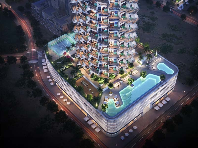 Binghatti Grove by Binghatti Developers offers a luxurious selection of 1 to 3-bedroom apartments in the family-friendly community of Jumeirah Village Circle (JVC). These off-plan apartments combine biophilic design with contemporary elegance, creating a unique blend of comfort and sustainability. Each residence features eco-friendly materials and sustainable facades, offering a mindful living environment for modern Dubai. The project provides an array of exceptional amenities, including a serene pool deck, outdoor yoga area, sports courts, and dedicated kids’ play areas. Residents can also enjoy an outdoor fitness zone and paddle courts, making it perfect for those looking to lead an active lifestyle. Additionally, the development offers stunning views of the surrounding green spaces, enhancing the overall living experience. Binghatti Grove’s prime location in JVC ensures easy access to Al Khail Road and Sheikh Mohammed Bin Zayed Road, allowing residents to reach key destinations like Downtown Dubai, Dubai Marina, and Dubai International Airport in under 25 minutes. The proximity to Circle Mall, parks, schools, and healthcare facilities adds further convenience for families and professionals. Starting at AED 1.2M, Binghatti Grove at JVC offers 1 to 3-bedroom apartments. The handover is expected in Q4 2026 with a 70/30 payment plan.