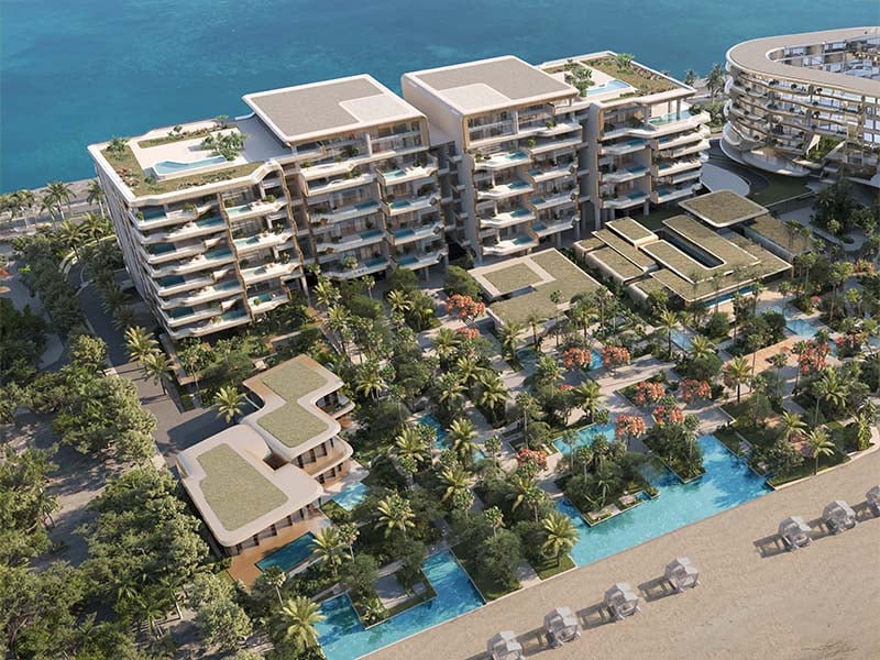 Ela Residences by Omniyat redefines ultra-luxury living on Palm Jumeirah. This exclusive collection of 3- and 4-bedroom apartments is crafted to embody the zenith of sophistication and privacy. Situated on one of the island’s most coveted plots, these residences offer sweeping views of the Arabian Gulf and the glittering Dubai skyline. Zaha Hadid's innovative architecture shapes Ela Residences with her signature style evident in the sweeping, fluid forms and cutting-edge aesthetics. Each residence features expansive terraces that seamlessly connect indoor living spaces with the serene outdoors. Floor-to-ceiling windows flood the interiors with natural light, enhancing the sense of openness and framing breathtaking vistas. The interiors, curated by the Dorchester Collection, reflect a commitment to luxury and refinement. Premium materials and bespoke finishes are meticulously chosen, creating spaces that are both elegant and functional. Each apartment is designed to offer a refined living experience where every detail contributes to an atmosphere of exclusivity and comfort. Located on the Eastern Crescent, Ela Residences offers direct beachfront access and panoramic views, providing a rare combination of privacy and prestige and setting a new standard for luxury living on Palm Jumeirah. Starting at AED 43M, Ela Residences by Omniyat offers 3- and 4-bedroom apartments. The handover is expected in Q1 2028 with a 60/40 payment plan.