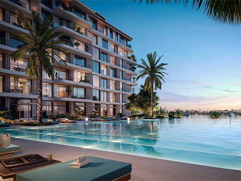 Bay Grove Residences by Nakheel offers a luxurious waterfront lifestyle in the heart of Dubai Islands. This stunning development features premium 1, 2 and 3-bedroom apartments, as well as exquisite 4-bedroom penthouses. Each residence is thoughtfully designed with spacious layouts, incorporating natural light and elegant finishes, creating a serene atmosphere. The interiors boast soft tones, warm wood accents and high-quality materials, ensuring a perfect blend of comfort and sophistication. Residents at Bay Grove Residences can indulge in a wide array of world-class amenities. The property includes an impressive infinity pool overlooking the ocean, beautifully landscaped podium gardens, a state-of-the-art fitness center and a dedicated kids’ play area. Additionally, the exclusive clubhouse and residents' lounge provide an elegant space for social gatherings and events, fostering a sense of community among residents. Located on Dubai Islands, Bay Grove Residences offers easy access to 20 kilometers of pristine beaches and a vibrant lifestyle surrounded by nature. The new Infinity Bridge connects these islands to the city, enhancing accessibility and convenience. Residents will appreciate the balance between urban living and tranquil coastal charm. Starting at AED 1.85M, Bay Grove Residences at Dubai Islands offers 1 to 3-bedroom apartments with handover expected in Q3 2028 and a 80/20 payment plan.