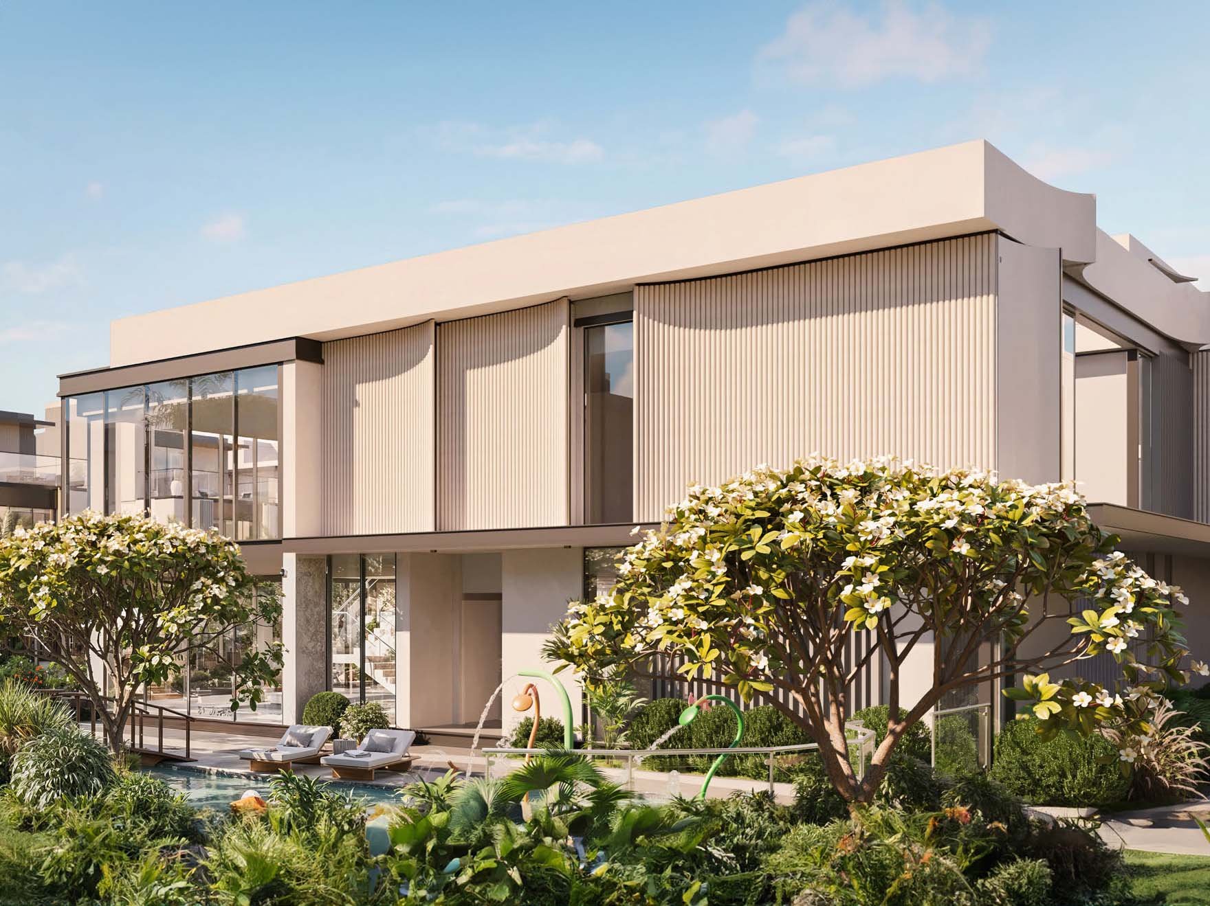 Ellington Properties unveils The Watercrest, a new addition to Mohammed Bin Rashid City. The community is defined by its flowing water features which elegantly merge with beautifully landscaped green spaces and gracefully curved pathways. Three distinct neighborhoods form The Watercrest. The Riverine offers 31 homes, each embracing the water's edge. The Alcove, with 25 units, provides intimate spaces for those who value privacy. The Arcadia rounds out the community with 28 residences, balancing openness and seclusion. Townhouses and villas stand in harmony with their surroundings. Three-bedroom townhouses flow from room to room while four-bedroom villas expand possibilities for family life. Large windows frame ever-changing views of gardens and water features. Inside, materials engage the senses. Wood warms underfoot, stone cools to the touch. Light plays across surfaces, shifting moods from dawn to dusk. Outdoor spaces become natural extensions of home from cozy balconies to spacious gardens. A river club anchors community life, its plunge pool a gathering point on warm days. Fitness and yoga studios promote well-being while an outdoor cinema brings neighbors together under the stars. Children find their own spaces in play areas and a dedicated kids' club.