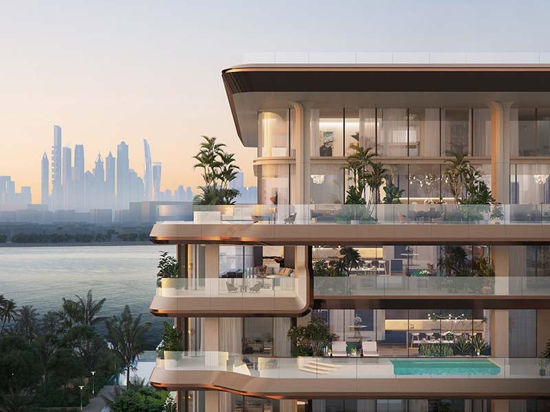 Ela Residences by Omniyat redefines ultra-luxury living on Palm Jumeirah. This exclusive collection of 3- and 4-bedroom apartments is crafted to embody the zenith of sophistication and privacy. Situated on one of the island’s most coveted plots, these residences offer sweeping views of the Arabian Gulf and the glittering Dubai skyline. Zaha Hadid's innovative architecture shapes Ela Residences with her signature style evident in the sweeping, fluid forms and cutting-edge aesthetics. Each residence features expansive terraces that seamlessly connect indoor living spaces with the serene outdoors. Floor-to-ceiling windows flood the interiors with natural light, enhancing the sense of openness and framing breathtaking vistas. The interiors, curated by the Dorchester Collection, reflect a commitment to luxury and refinement. Premium materials and bespoke finishes are meticulously chosen, creating spaces that are both elegant and functional. Each apartment is designed to offer a refined living experience where every detail contributes to an atmosphere of exclusivity and comfort. Located on the Eastern Crescent, Ela Residences offers direct beachfront access and panoramic views, providing a rare combination of privacy and prestige and setting a new standard for luxury living on Palm Jumeirah. Starting at AED 43M, Ela Residences by Omniyat offers 3- and 4-bedroom apartments. The handover is expected in Q1 2028 with a 60/40 payment plan.