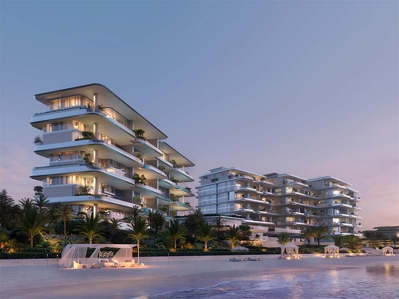 Ela Residences by Omniyat redefines ultra-luxury living on Palm Jumeirah. This exclusive collection of 3- and 4-bedroom apartments is crafted to embody the zenith of sophistication and privacy. Situated on one of the island’s most coveted plots, these residences offer sweeping views of the Arabian Gulf and the glittering Dubai skyline. Zaha Hadid's innovative architecture shapes Ela Residences with her signature style evident in the sweeping, fluid forms and cutting-edge aesthetics. Each residence features expansive terraces that seamlessly connect indoor living spaces with the serene outdoors. Floor-to-ceiling windows flood the interiors with natural light, enhancing the sense of openness and framing breathtaking vistas. The interiors, curated by the Dorchester Collection, reflect a commitment to luxury and refinement. Premium materials and bespoke finishes are meticulously chosen, creating spaces that are both elegant and functional. Each apartment is designed to offer a refined living experience where every detail contributes to an atmosphere of exclusivity and comfort. Located on the Eastern Crescent, Ela Residences offers direct beachfront access and panoramic views, providing a rare combination of privacy and prestige and setting a new standard for luxury living on Palm Jumeirah. Starting at AED 43M, Ela Residences by Omniyat offers 3- and 4-bedroom apartments. The handover is expected in Q1 2028 with a 60/40 payment plan.