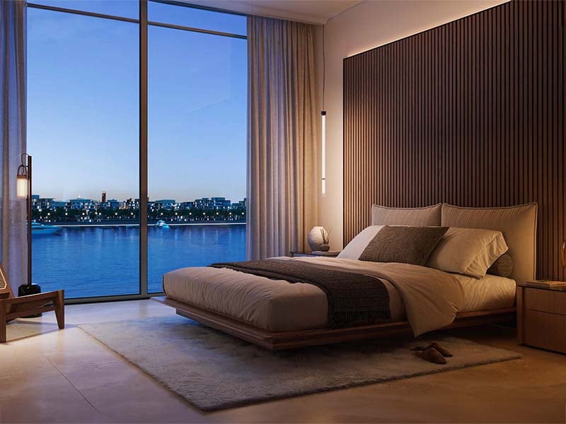 Bay Grove Residences by Nakheel offers a luxurious waterfront lifestyle in the heart of Dubai Islands. This stunning development features premium 1, 2 and 3-bedroom apartments, as well as exquisite 4-bedroom penthouses. Each residence is thoughtfully designed with spacious layouts, incorporating natural light and elegant finishes, creating a serene atmosphere. The interiors boast soft tones, warm wood accents and high-quality materials, ensuring a perfect blend of comfort and sophistication. Residents at Bay Grove Residences can indulge in a wide array of world-class amenities. The property includes an impressive infinity pool overlooking the ocean, beautifully landscaped podium gardens, a state-of-the-art fitness center and a dedicated kids’ play area. Additionally, the exclusive clubhouse and residents' lounge provide an elegant space for social gatherings and events, fostering a sense of community among residents. Located on Dubai Islands, Bay Grove Residences offers easy access to 20 kilometers of pristine beaches and a vibrant lifestyle surrounded by nature. The new Infinity Bridge connects these islands to the city, enhancing accessibility and convenience. Residents will appreciate the balance between urban living and tranquil coastal charm. Starting at AED 1.85M, Bay Grove Residences at Dubai Islands offers 1 to 3-bedroom apartments with handover expected in Q3 2028 and a 80/20 payment plan.