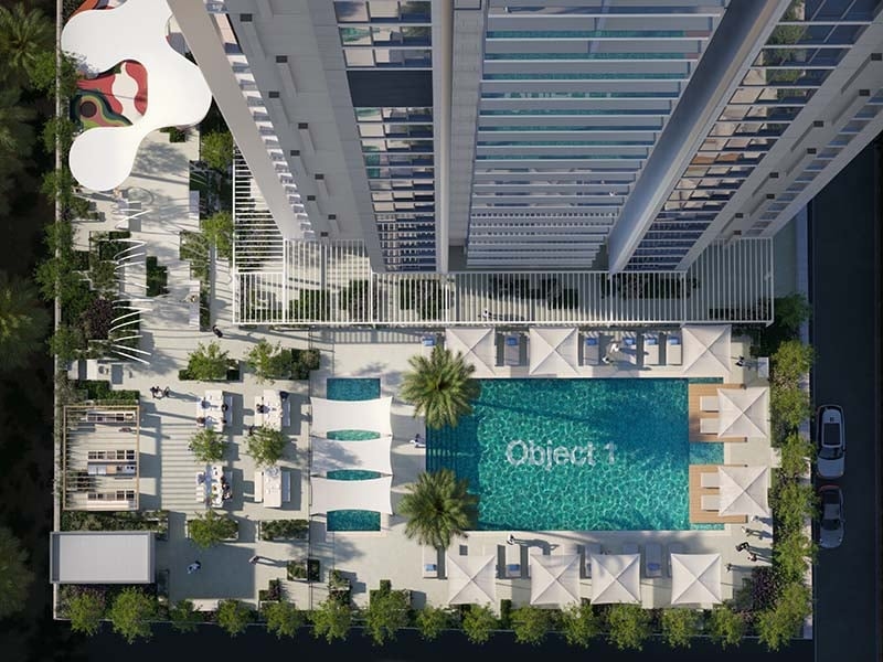 The Fifth Tower by Object 1 in Jumeirah Village Circle stands as a striking addition to Dubai's skyline. This 36-floor project offers studios and one to two-bedroom apartments designed with clean lines and modern elements. The Fifth Tower features spaces that flow with ease. Each unit offers a neutral palette and spacious layout, ensuring a calm and inviting atmosphere. Large windows draw in light and frame views of the city. Inside, wood accents and thoughtful finishes add warmth and a sense of home. Residents enter through a welcoming lobby lounge with seating and concierge services. Amenities cater to diverse needs. A pool and kid’s play area provide spaces for leisure, while a gym supports an active lifestyle. An indoor cinema adds a touch of entertainment. Each shared space enhances the living experience, fostering a sense of community. Living at The Fifth Tower at Jumeirah Village Circle means enjoying a blend of urban convenience and peaceful spaces. The thoughtful layout and design choices ensure each home is both functional and pleasing to the eye. It's a place where residents can relax, entertain and thrive. Starting at AED 554K, The Fifth Tower by Object 1 offers studios and one to two-bedroom apartments. The handover is expected in Q4 2026 with a 60/40 payment plan.