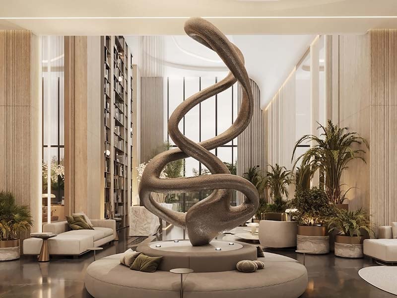 Cove by Imtiaz emerges in Dubailand as a vertical sanctuary. Its pearl white façade echoes the desert's timeless palette while its interiors redefine urban living. Within this tower, homes range from studios to two-bedroom retreats. Each space tells a story of thoughtful design. Kitchens become culinary stages with clean lines and intuitive layouts. Bathrooms transform into personal spas, marrying form and function. Bedrooms offer respite with views that frame Dubai's evolving skyline. Cove's true character unfolds in its shared spaces. An infinity pool seemingly merges with the horizon. For the active, a padel court awaits. A running track winds through the property, offering a path for morning jogs or evening strolls. Quieter moments find their place too. Serene cabanas offer pockets of tranquility. A yoga deck and a fully equipped gym, with its array of equipment, stand ready for those seeking a moment of calm or physical challenge. As day turns to evening, the open-air cinema flickers to life. Nearby, BBQ areas invite culinary experiments and social gatherings. Throughout Cove, green spaces create breathing room. These pockets of nature soften the urban edge, providing impromptu meeting spots or solitary retreats.