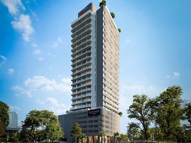 Avant Garde Residences, nestled in the heart of Jumeirah Village Circle, stands as a testament to thoughtful contemporary architecture. Its façade, adorned with subtle staggered curves, pays homage to the undulating dunes of the Arabian desert and the rhythmic tides of the nearby gulf. Striking a delicate balance between technical functionality and elegant aesthetics, the building's orientation was carefully orchestrated to optimize views from every apartment. This strategic positioning ensures practical living spaces and breathtaking perspectives throughout. Each detail of Avant Garde Residences speaks to a commitment to craftsmanship of the highest caliber. From the spacious interiors to the meticulously chosen materials, residents are assured of uncompromising quality and enduring value. Soft, soothing pastels coupled with a natural material palette create an atmosphere of timeless elegance and warmth. World-class fixtures and fittings further enhance this environment, promising durability and longevity. Floor-to-ceiling windows flood the interiors with natural light, seamlessly merging indoor and outdoor spaces. Thoughtfully designed balcony areas offer residents a retreat to enjoy fresh air and open skies. Starting at an accessible AED 650K, Avant Garde Residences by Skyline Builders presents a range of studio and one to two-bedroom apartments. The handover is slated for Q4 2026 with a convenient 50/50 payment plan.