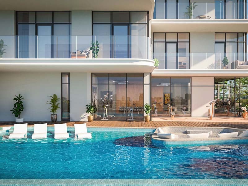 Avant Garde Residences, nestled in the heart of Jumeirah Village Circle, stands as a testament to thoughtful contemporary architecture. Its façade, adorned with subtle staggered curves, pays homage to the undulating dunes of the Arabian desert and the rhythmic tides of the nearby gulf. Striking a delicate balance between technical functionality and elegant aesthetics, the building's orientation was carefully orchestrated to optimize views from every apartment. This strategic positioning ensures practical living spaces and breathtaking perspectives throughout. Each detail of Avant Garde Residences speaks to a commitment to craftsmanship of the highest caliber. From the spacious interiors to the meticulously chosen materials, residents are assured of uncompromising quality and enduring value. Soft, soothing pastels coupled with a natural material palette create an atmosphere of timeless elegance and warmth. World-class fixtures and fittings further enhance this environment, promising durability and longevity. Floor-to-ceiling windows flood the interiors with natural light, seamlessly merging indoor and outdoor spaces. Thoughtfully designed balcony areas offer residents a retreat to enjoy fresh air and open skies. Starting at an accessible AED 650K, Avant Garde Residences by Skyline Builders presents a range of studio and one to two-bedroom apartments. The handover is slated for Q4 2026 with a convenient 50/50 payment plan.