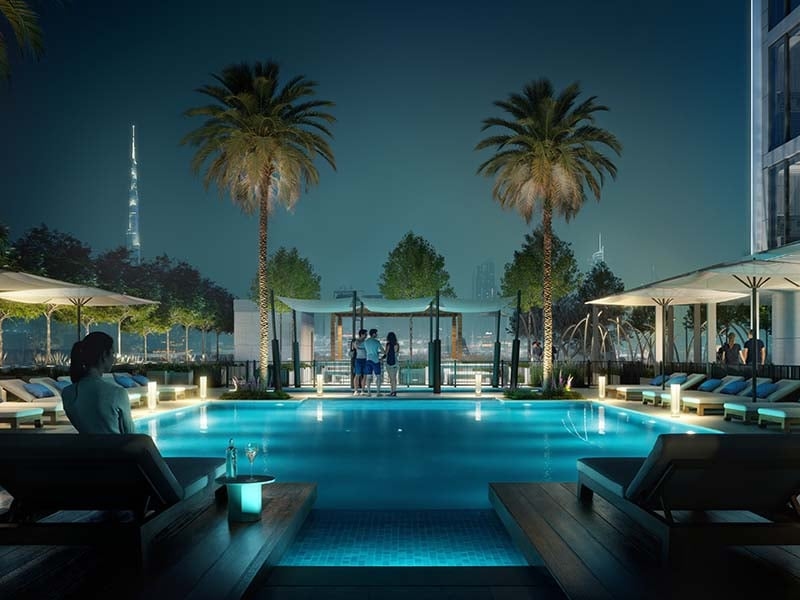 The Fifth Tower by Object 1 in Jumeirah Village Circle stands as a striking addition to Dubai's skyline. This 36-floor project offers studios and one to two-bedroom apartments designed with clean lines and modern elements. The Fifth Tower features spaces that flow with ease. Each unit offers a neutral palette and spacious layout, ensuring a calm and inviting atmosphere. Large windows draw in light and frame views of the city. Inside, wood accents and thoughtful finishes add warmth and a sense of home. Residents enter through a welcoming lobby lounge with seating and concierge services. Amenities cater to diverse needs. A pool and kid’s play area provide spaces for leisure, while a gym supports an active lifestyle. An indoor cinema adds a touch of entertainment. Each shared space enhances the living experience, fostering a sense of community. Living at The Fifth Tower at Jumeirah Village Circle means enjoying a blend of urban convenience and peaceful spaces. The thoughtful layout and design choices ensure each home is both functional and pleasing to the eye. It's a place where residents can relax, entertain and thrive. Starting at AED 554K, The Fifth Tower by Object 1 offers studios and one to two-bedroom apartments. The handover is expected in Q4 2026 with a 60/40 payment plan.