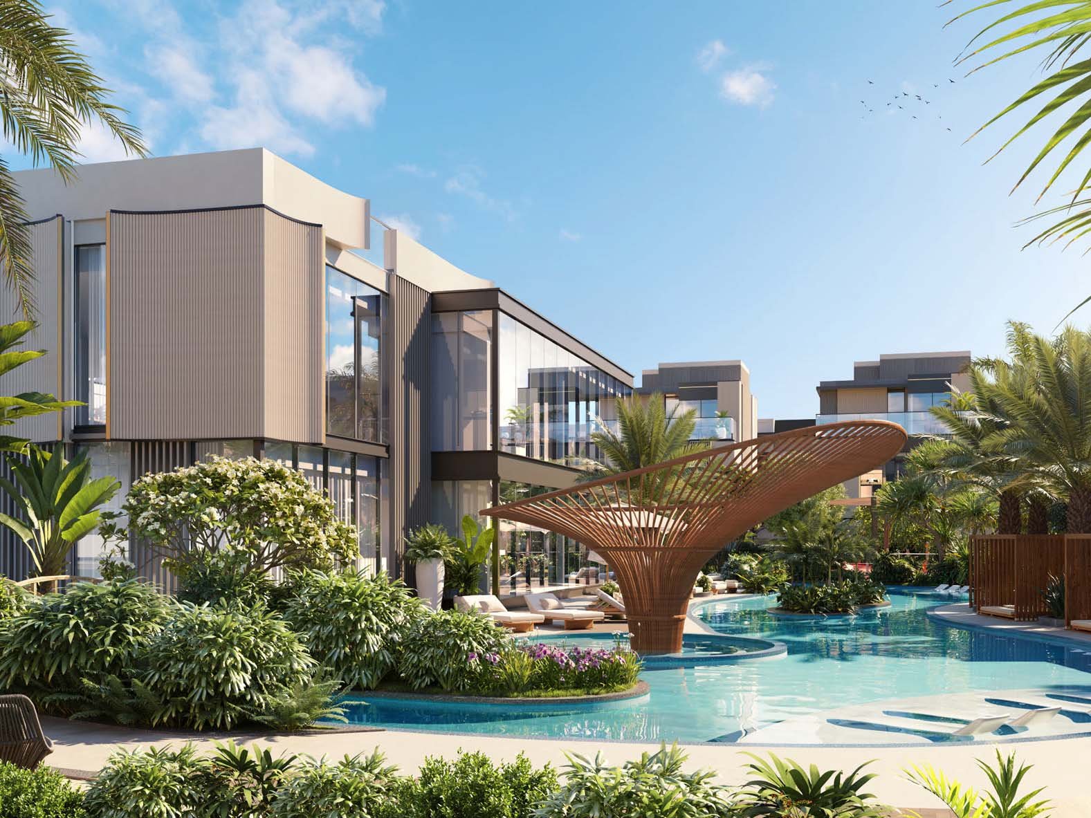 Ellington Properties unveils The Watercrest, a new addition to Mohammed Bin Rashid City. The community is defined by its flowing water features which elegantly merge with beautifully landscaped green spaces and gracefully curved pathways. Three distinct neighborhoods form The Watercrest. The Riverine offers 31 homes, each embracing the water's edge. The Alcove, with 25 units, provides intimate spaces for those who value privacy. The Arcadia rounds out the community with 28 residences, balancing openness and seclusion. Townhouses and villas stand in harmony with their surroundings. Three-bedroom townhouses flow from room to room while four-bedroom villas expand possibilities for family life. Large windows frame ever-changing views of gardens and water features. Inside, materials engage the senses. Wood warms underfoot, stone cools to the touch. Light plays across surfaces, shifting moods from dawn to dusk. Outdoor spaces become natural extensions of home from cozy balconies to spacious gardens. A river club anchors community life, its plunge pool a gathering point on warm days. Fitness and yoga studios promote well-being while an outdoor cinema brings neighbors together under the stars. Children find their own spaces in play areas and a dedicated kids' club.