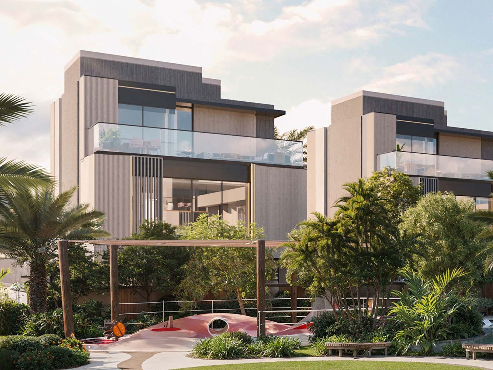 Ellington Properties unveils The Watercrest, a new addition to Mohammed Bin Rashid City. The community is defined by its flowing water features which elegantly merge with beautifully landscaped green spaces and gracefully curved pathways. Three distinct neighborhoods form The Watercrest. The Riverine offers 31 homes, each embracing the water's edge. The Alcove, with 25 units, provides intimate spaces for those who value privacy. The Arcadia rounds out the community with 28 residences, balancing openness and seclusion. Townhouses and villas stand in harmony with their surroundings. Three-bedroom townhouses flow from room to room while four-bedroom villas expand possibilities for family life. Large windows frame ever-changing views of gardens and water features. Inside, materials engage the senses. Wood warms underfoot, stone cools to the touch. Light plays across surfaces, shifting moods from dawn to dusk. Outdoor spaces become natural extensions of home from cozy balconies to spacious gardens. A river club anchors community life, its plunge pool a gathering point on warm days. Fitness and yoga studios promote well-being while an outdoor cinema brings neighbors together under the stars. Children find their own spaces in play areas and a dedicated kids' club.